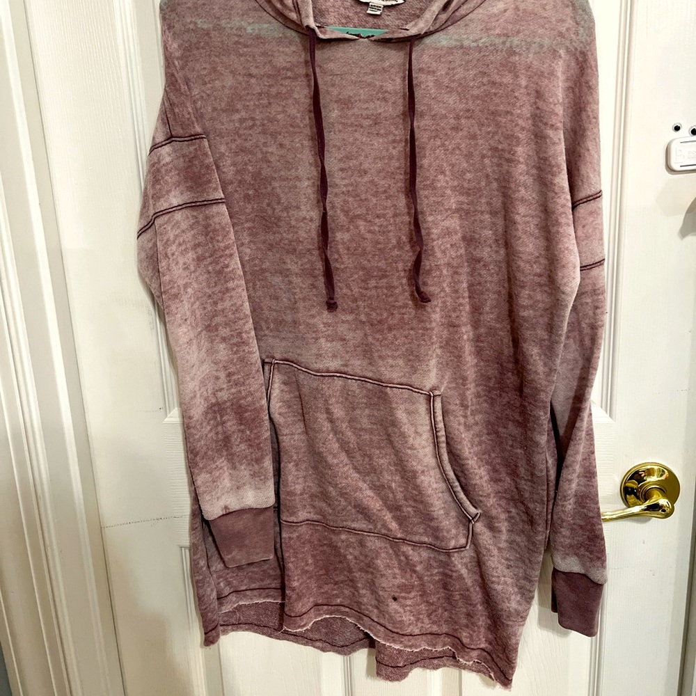 Worn burgundy sweatshirt